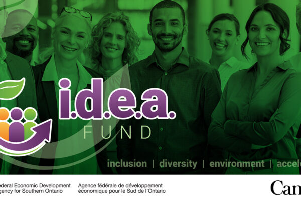 A diverse group of people stand together with idea fund logo overlayed on top.
